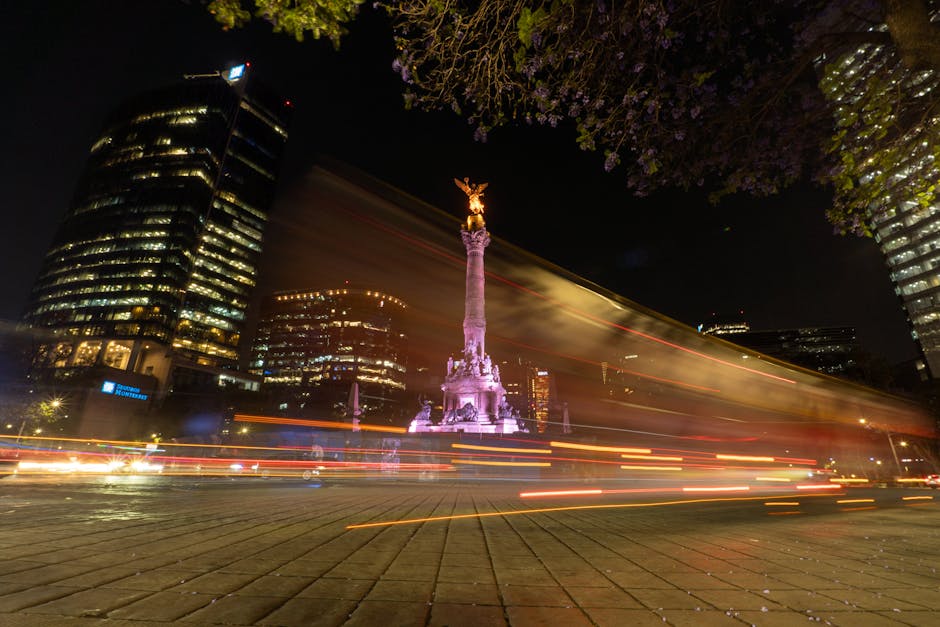 Dazzling night scene of Angel of Independence with light trails on Paseo de la Reforma, Mexico City.